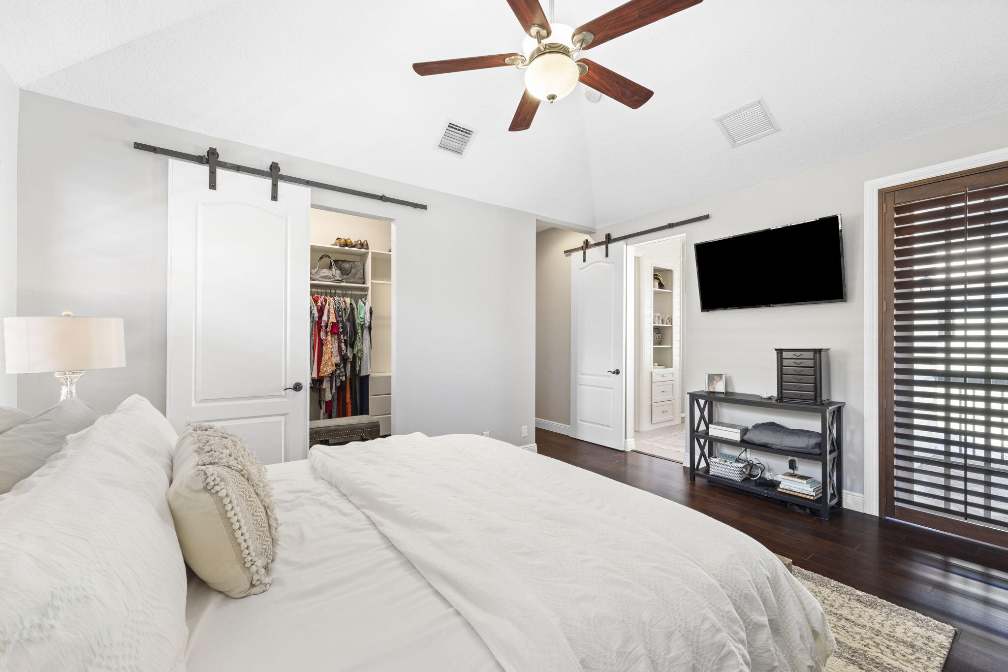 202 Botanica Drive Jupiter, FL 33458 - Photo 17 of 33 a bedroom with a bed and a flat screen tv