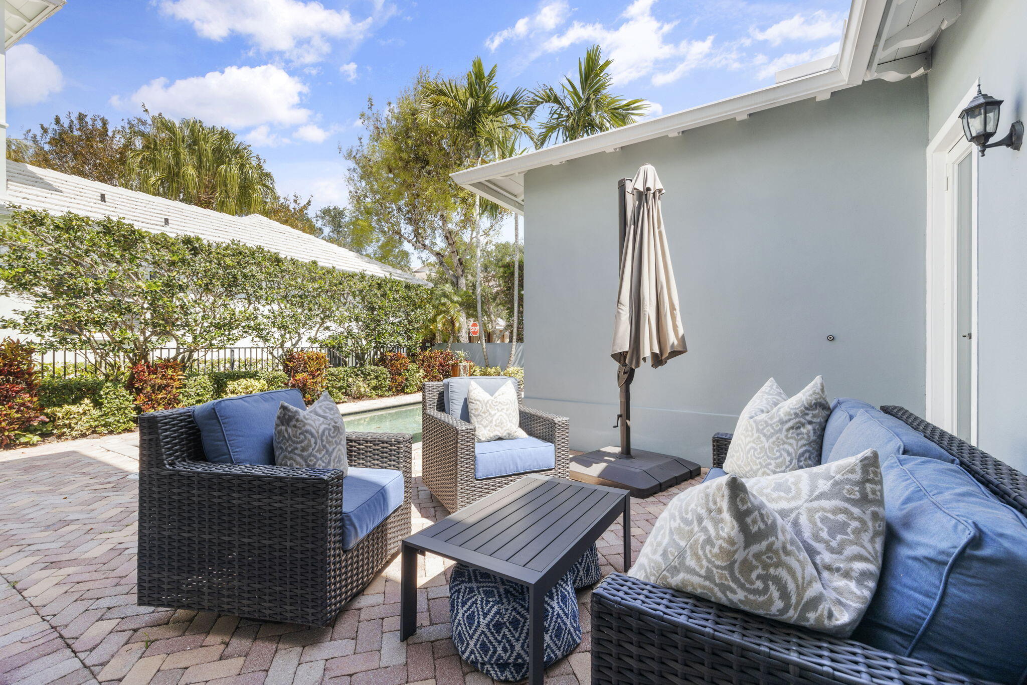 202 Botanica Drive Jupiter, FL 33458 - Photo 28 of 33 a outdoor living room with furniture and a potted plant