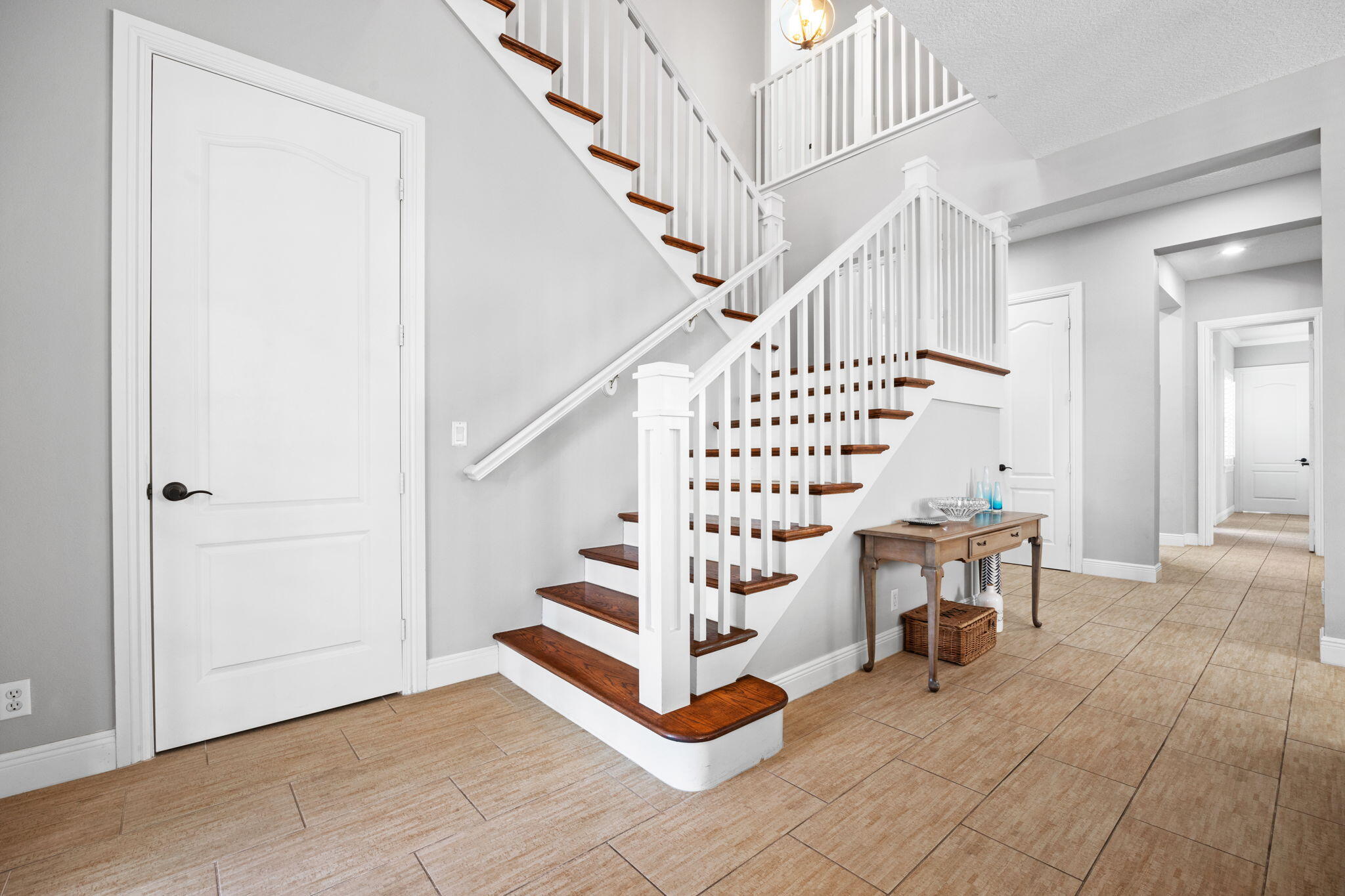 202 Botanica Drive Jupiter, FL 33458 - Photo 4 of 33 a view of entryway with hardwood and stairs