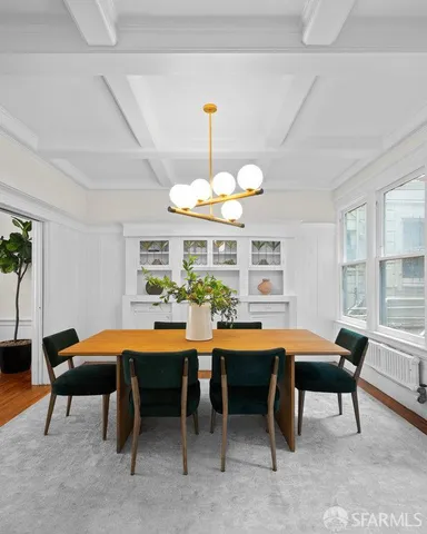 a dining room with a table and chairs