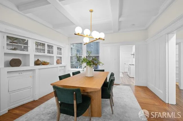 a view of a dining room with furniture and window