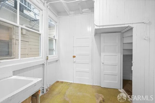a bathroom with a tub and sink