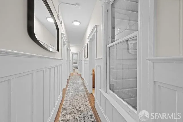 a bathroom with a sink a mirror and a shower