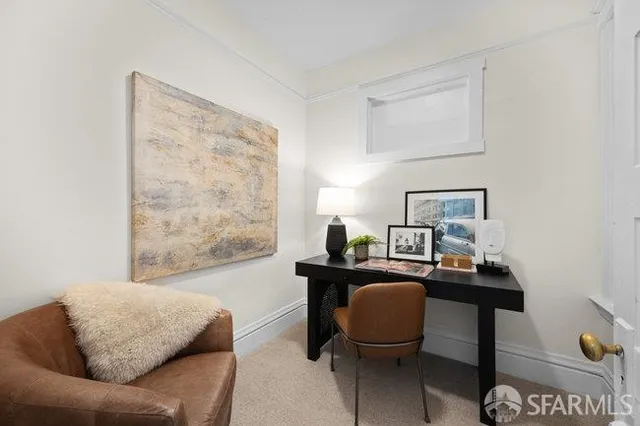 a bedroom with furniture and a window