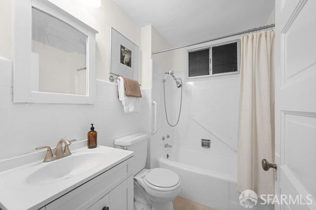 1108-1112 Pine Street San Francisco, CA 94109 - Photo 32 of 53 a bathroom with a sink toilet vanity and shower
