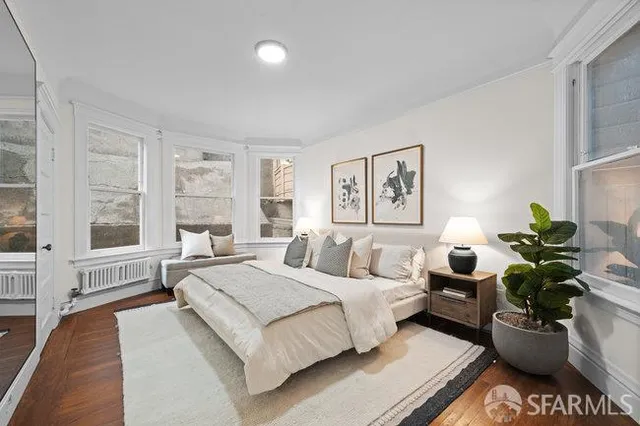 a spacious bedroom with a bed and a couch