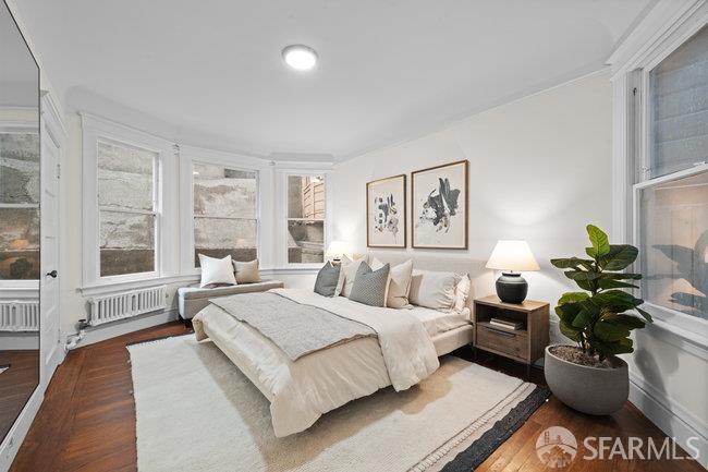 1108-1112 Pine Street San Francisco, CA 94109 - Photo 33 of 53 a spacious bedroom with a bed and a couch