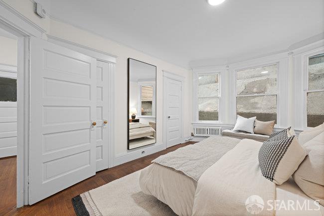 1108-1112 Pine Street San Francisco, CA 94109 - Photo 37 of 53 a bedroom with a bed and a window