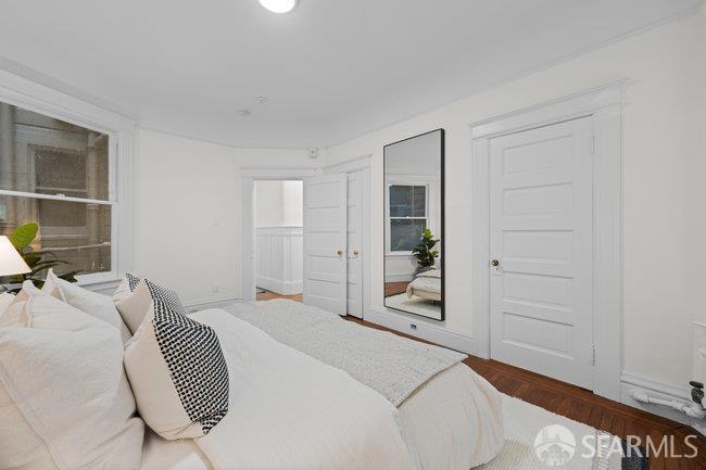 1108-1112 Pine Street San Francisco, CA 94109 - Photo 39 of 53 a bedroom with a bed and a window