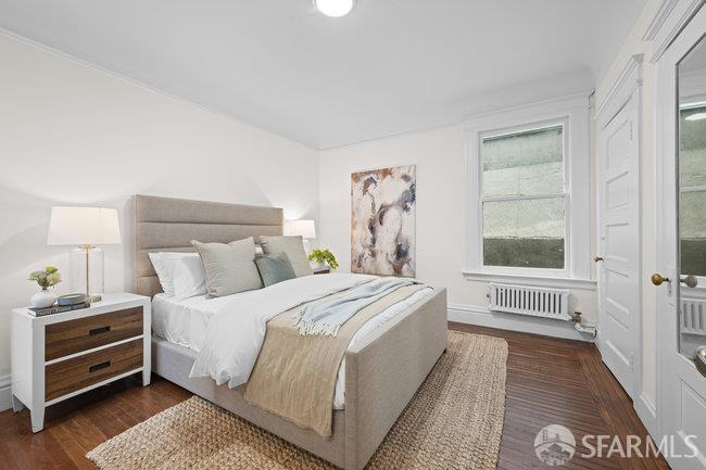 1108-1112 Pine Street San Francisco, CA 94109 - Photo 40 of 53 a bedroom with a bed and a window