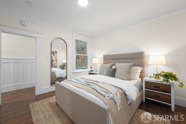 1108-1112 Pine Street San Francisco, CA 94109 - Photo 42 of 53 a bedroom with a bed and a potted plant