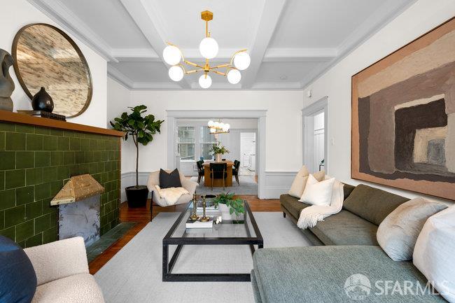 1108-1112 Pine Street San Francisco, CA 94109 - Photo 10 of 53 a living room with furniture a chandelier and a mirror