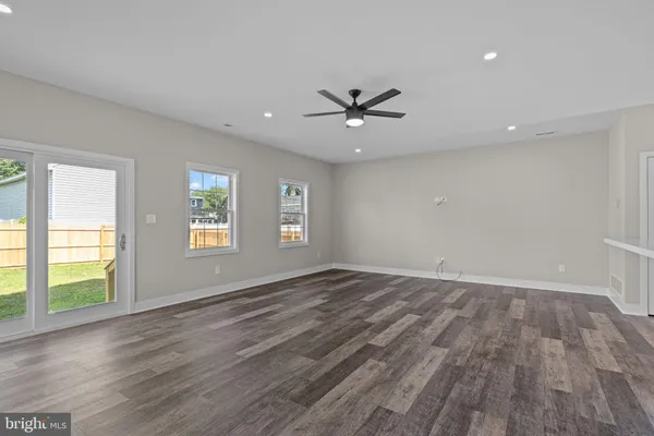 a view of an entryway with wooden floor