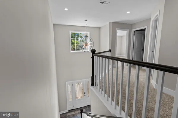 a view of a hallway with stairs