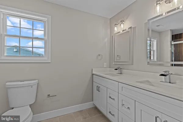 a bathroom with a shower and a sink