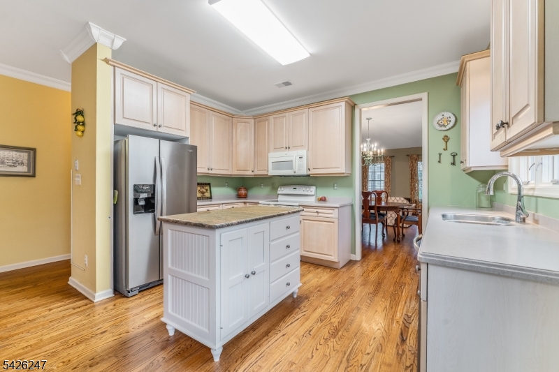 43 Falcon Way Washington, NJ 07882 - Photo 13 of 29 a kitchen with white cabinets and stainless steel appliances