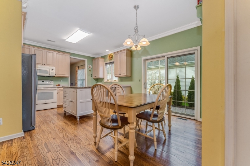 43 Falcon Way Washington, NJ 07882 - Photo 15 of 29 a view of a dining room with furniture and wooden floor