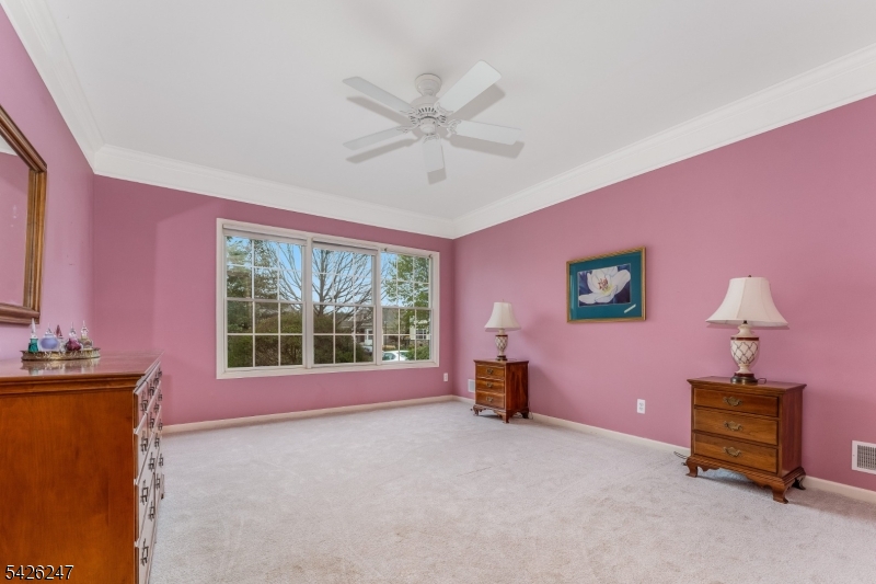 43 Falcon Way Washington, NJ 07882 - Photo 18 of 29 a spacious bedroom with a bed and a window