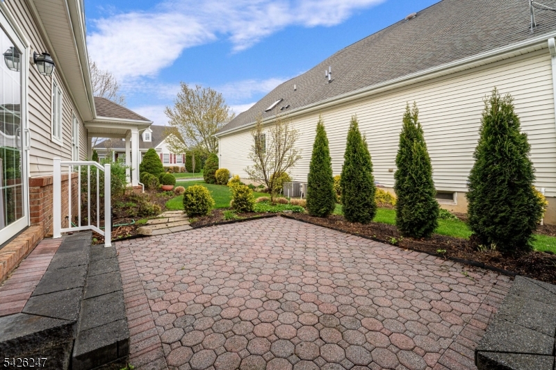43 Falcon Way Washington, NJ 07882 - Photo 28 of 29 a view of backyard with plants and outdoor seating