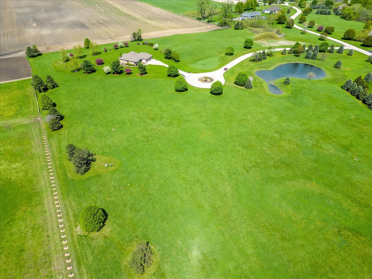 17405 Wildflower Circle Union, IL 60180 - Photo 9 of 18 a view of a garden with plants and large trees