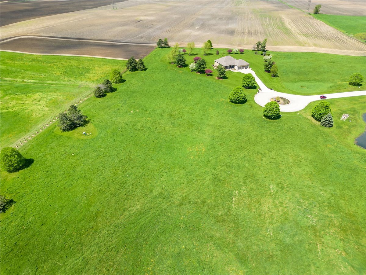 17405 Wildflower Circle Union, IL 60180 - Photo 10 of 18 a backyard of a house with lots of green space and outdoor seating