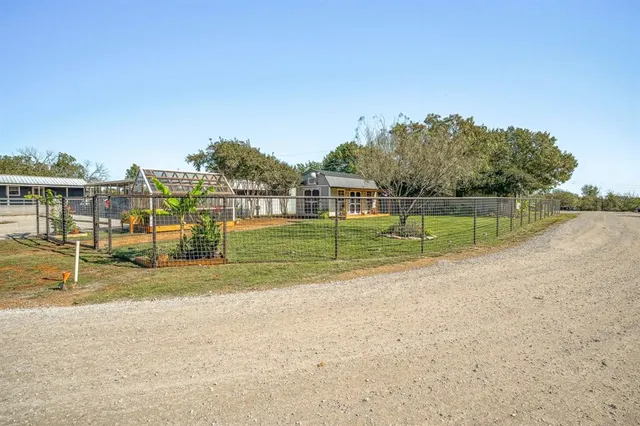 a view of a park with houses