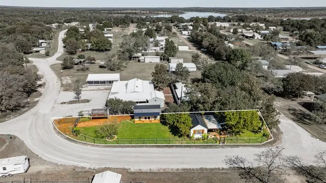 an aerial view of a house with a swimming pool
