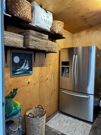 a kitchen with a refrigerator and a table