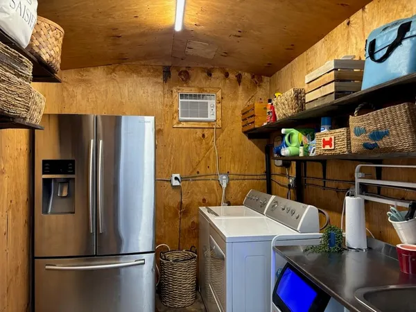 a kitchen with stainless steel appliances a refrigerator and a sink