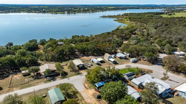 an aerial view of a city with lake view