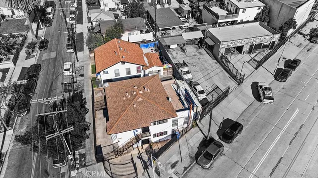 an aerial view of a house with swimming pool and patio