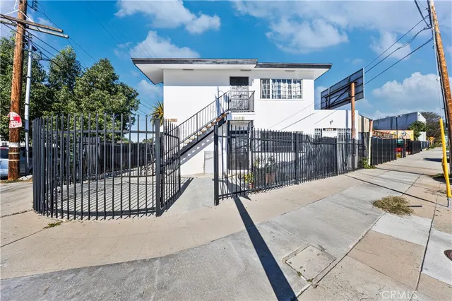 a view of a house with a wooden deck