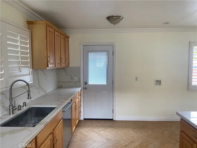 a kitchen with a sink and cabinets