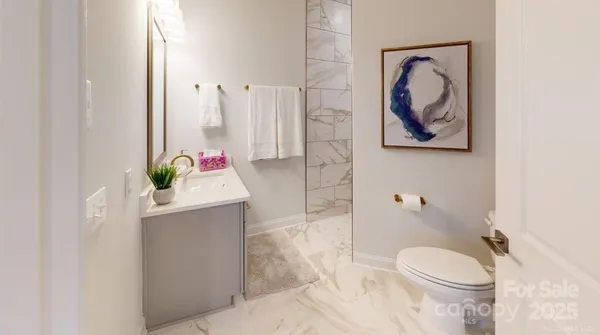 a bathroom with a toilet sink and tub