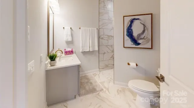 a bathroom with a toilet sink and tub