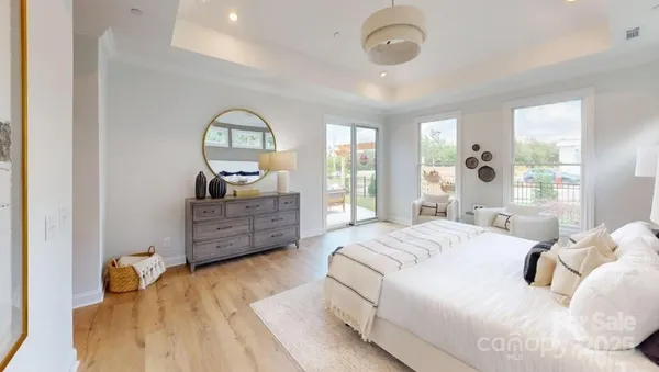a bedroom with a bed dresser and a window