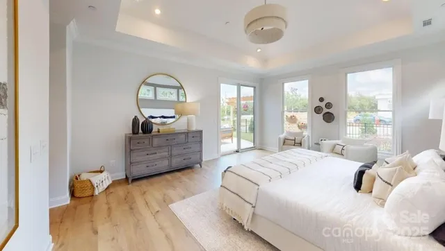 a bedroom with a bed dresser and a window