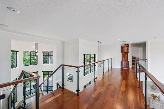 a view of staircase with wooden floor and a window