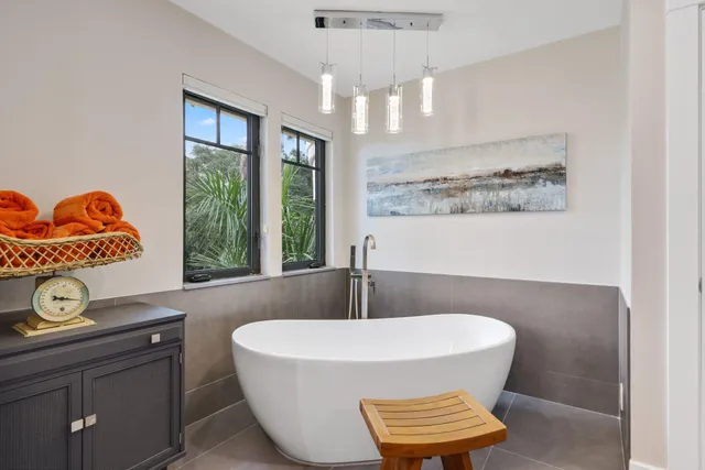 a bathroom with a bathtub and a window