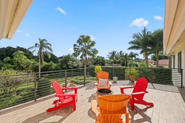 a view of a house with swimming pool and sitting area