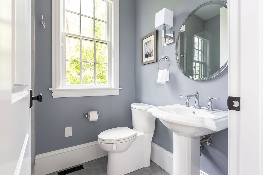 16 Grace Road Newton, MA 02459 - Photo 11 of 36 a bathroom with a toilet a sink and mirror