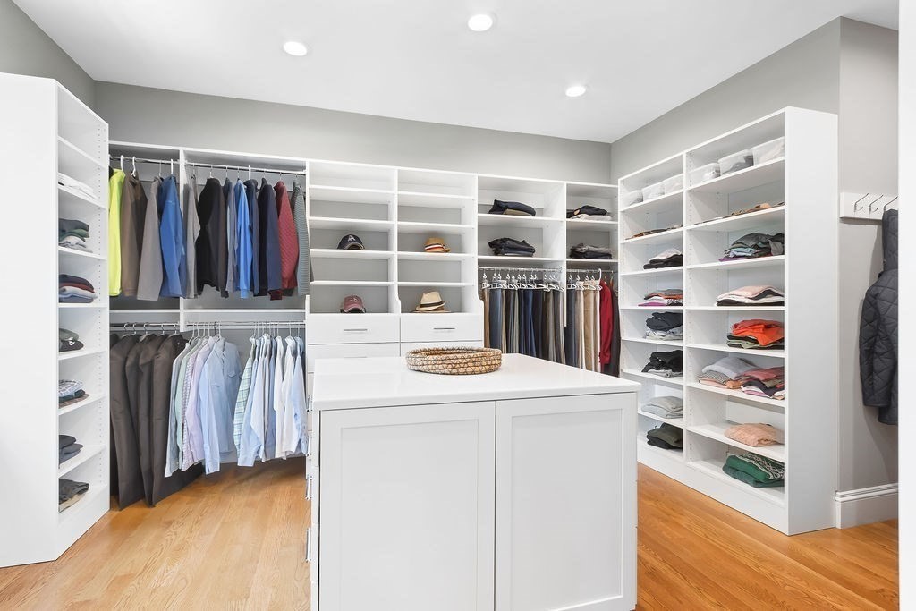 16 Grace Road Newton, MA 02459 - Photo 17 of 36 a view of walk in closet with clothes and shoes