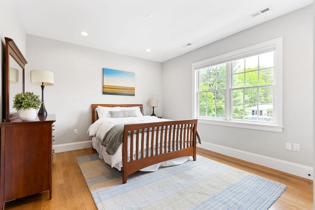 16 Grace Road Newton, MA 02459 - Photo 20 of 36 a bedroom with a bed and a window