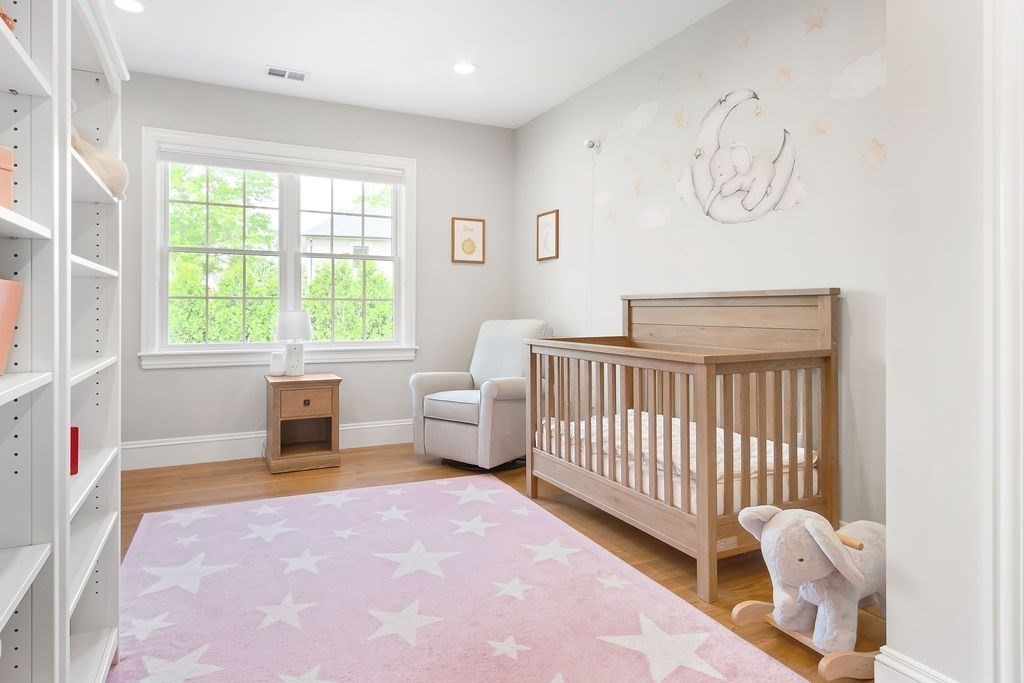 16 Grace Road Newton, MA 02459 - Photo 22 of 36 a bedroom with furniture and a window