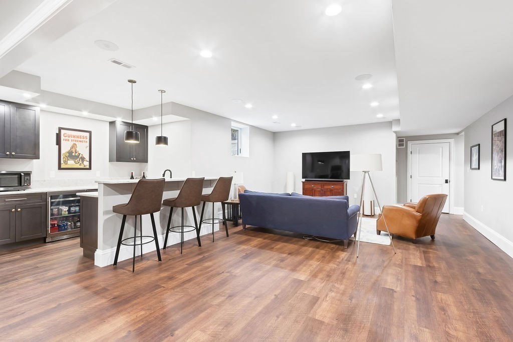 16 Grace Road Newton, MA 02459 - Photo 24 of 36 a living room with furniture and a flat screen tv