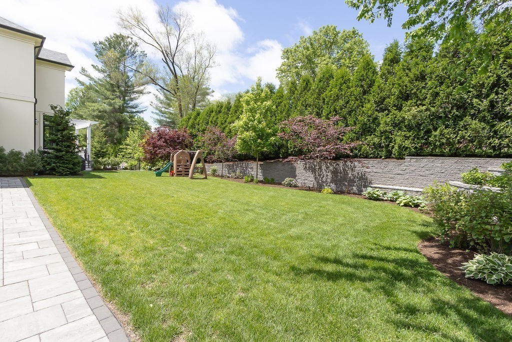 16 Grace Road Newton, MA 02459 - Photo 29 of 36 a view of a backyard with a garden