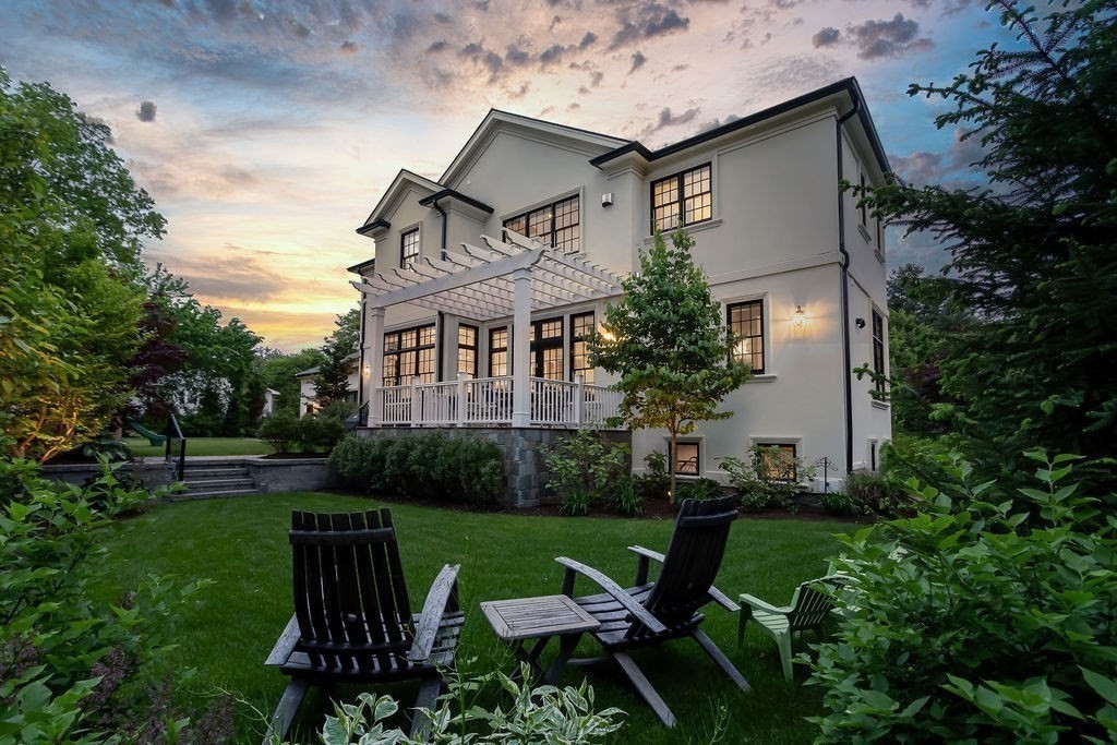 16 Grace Road Newton, MA 02459 - Photo 31 of 36 a view of a house with backyard sitting area and garden