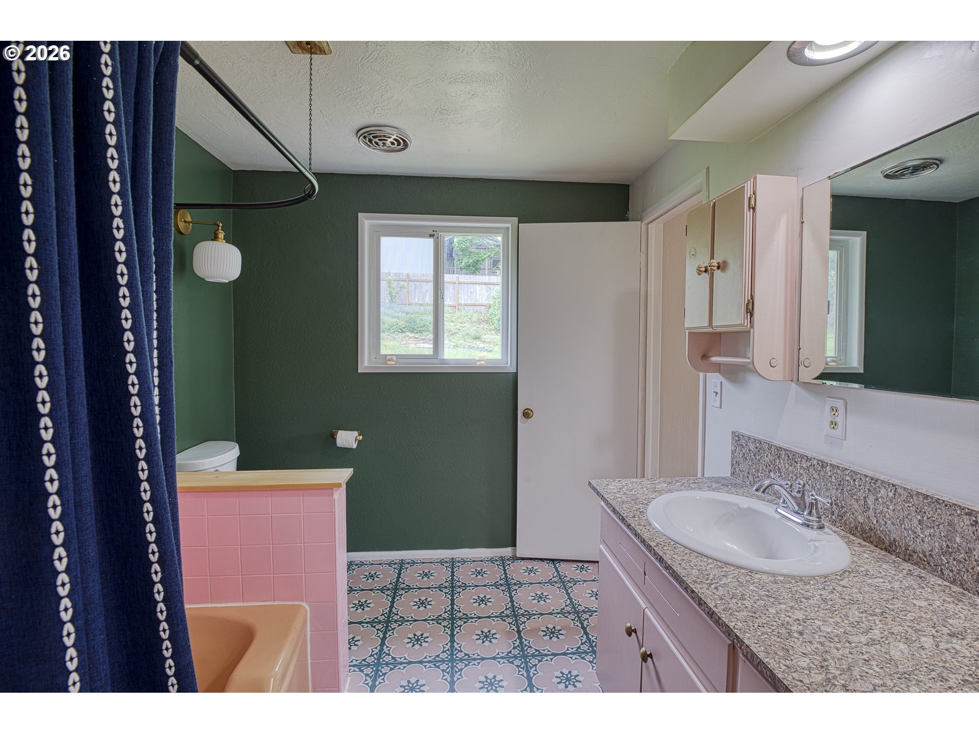 7077 Main Street Springfield, OR 97478 - Photo 17 of 34 a bathroom with a sink a toilet and mirror