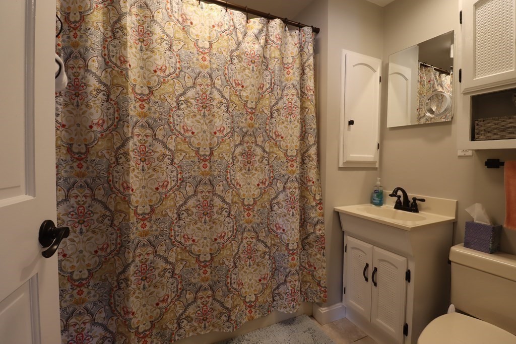 31 Longview Way Peabody, MA 01960 - Photo 13 of 42 a bathroom with a sink toilet and mirror