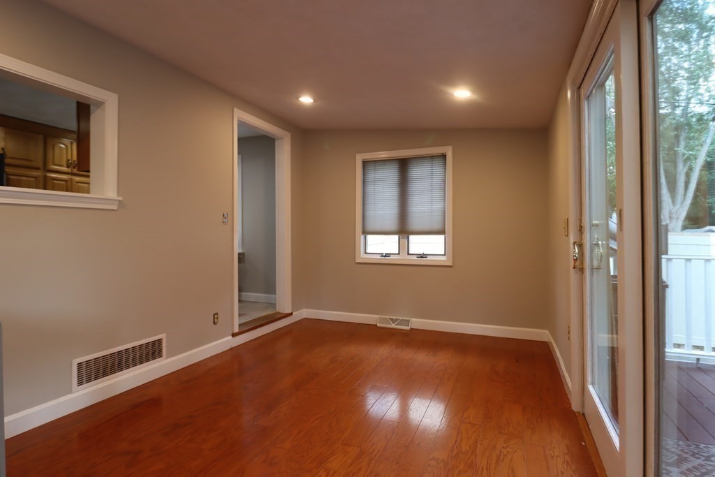 31 Longview Way Peabody, MA 01960 - Photo 14 of 42 an empty room with wooden floor and windows